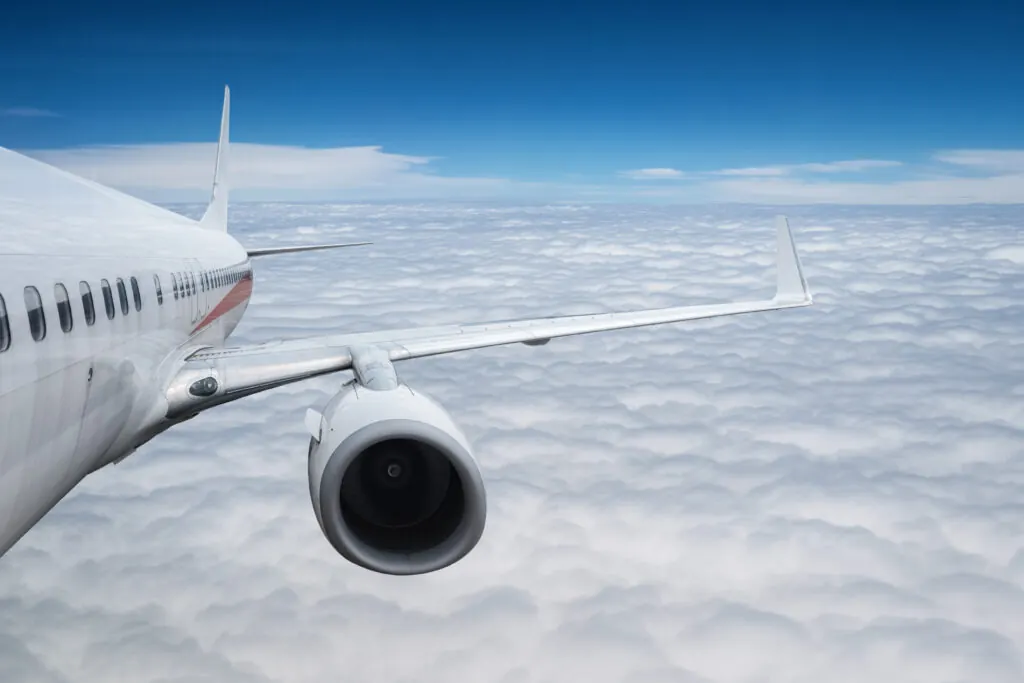 Airplane flying above the clouds